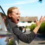 angry businesswoman in car angry with another driver